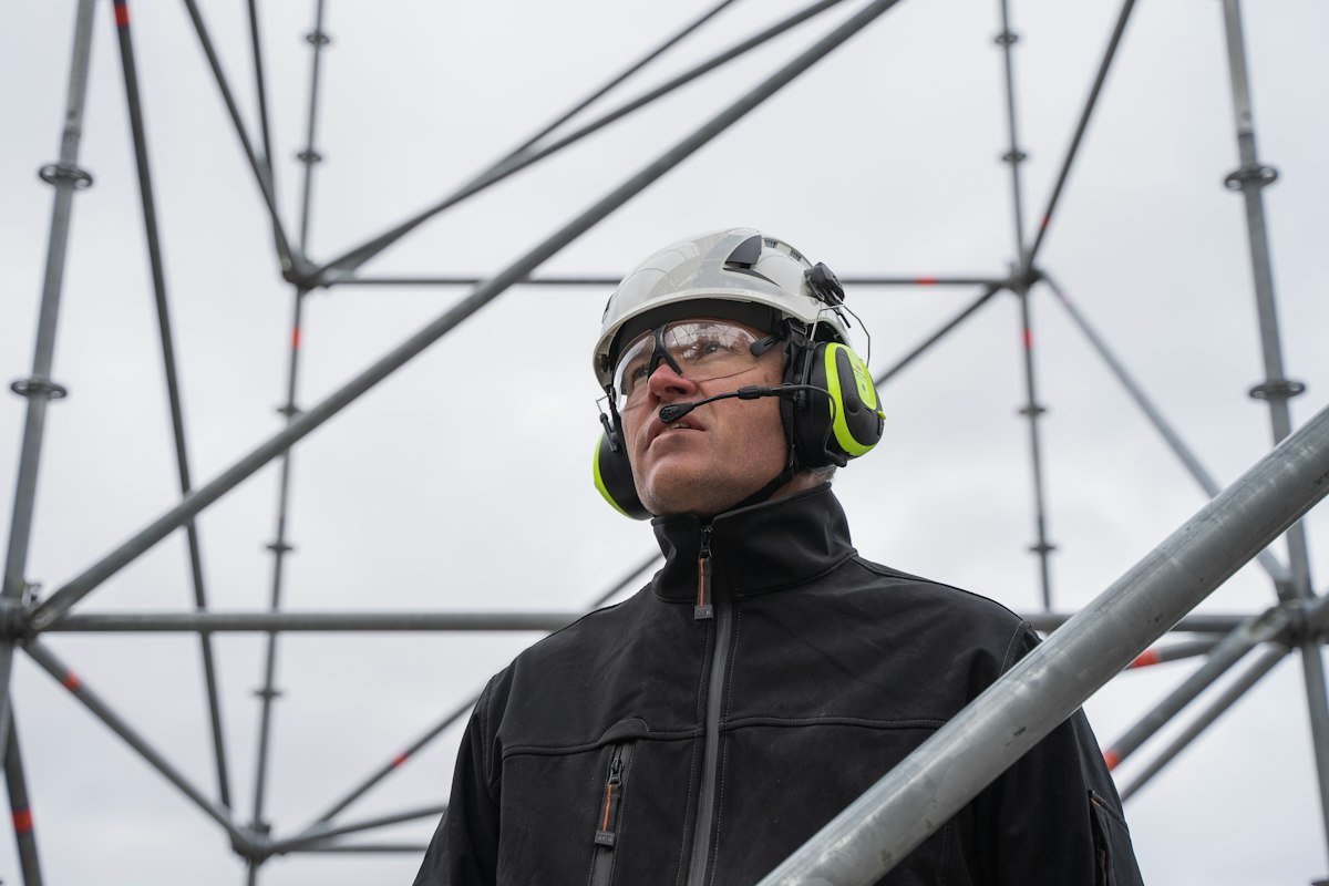Worker wearing helmet and safety goggles