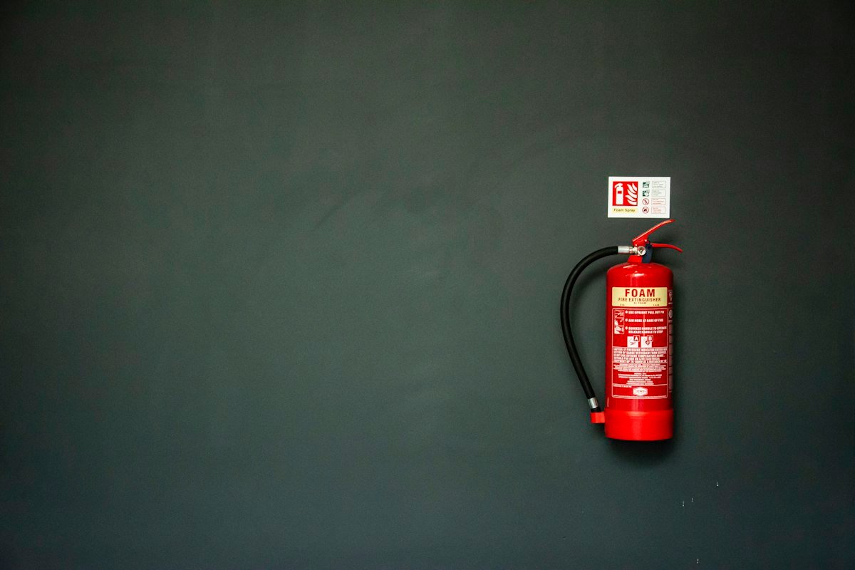 Red fire extinguisher on a wall